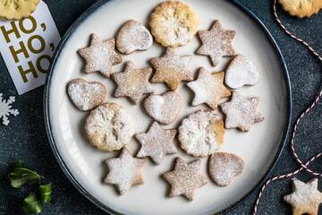 a plate of cookies and a string of snowflakes