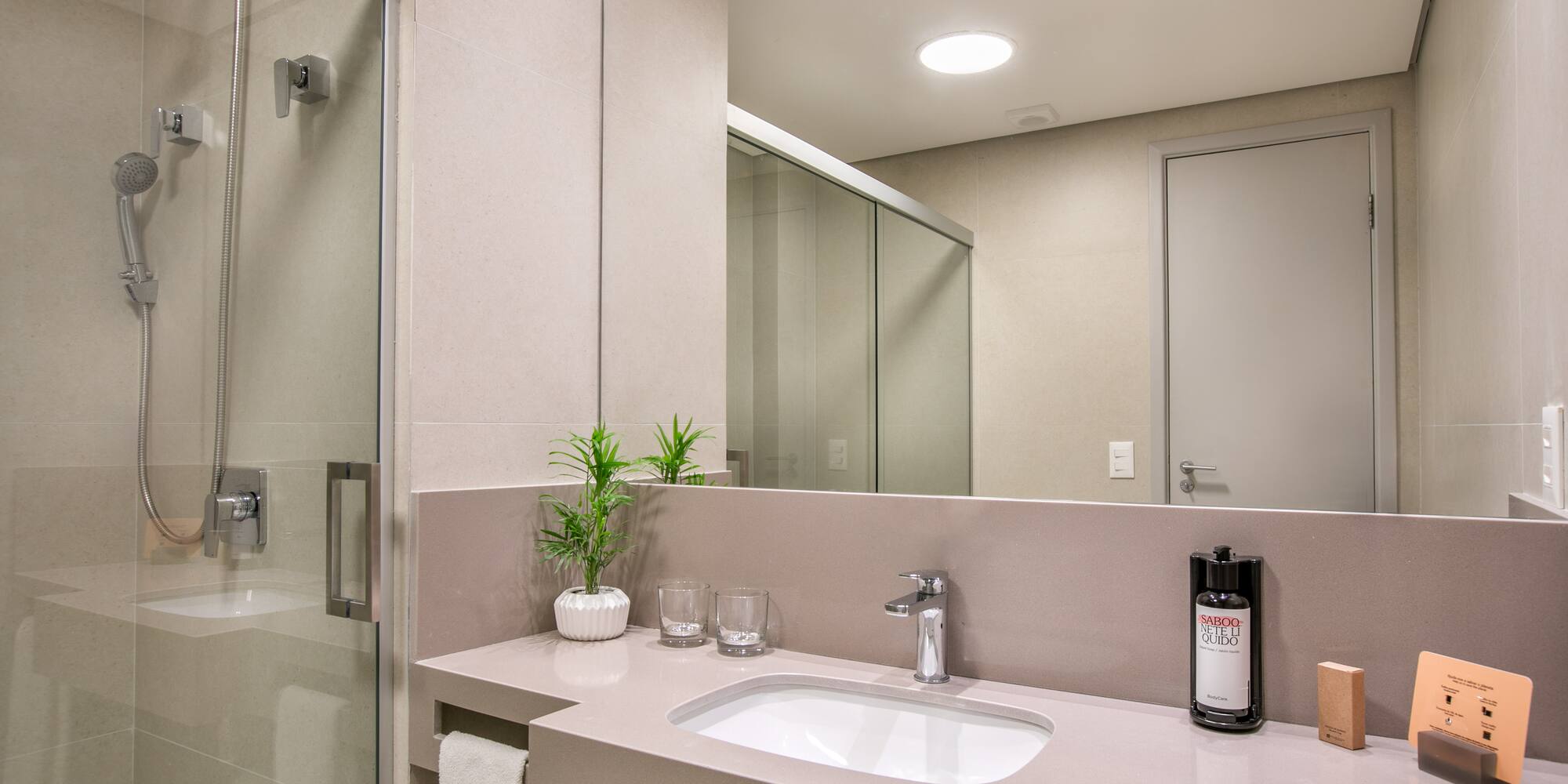 a bathroom with a sink and shower