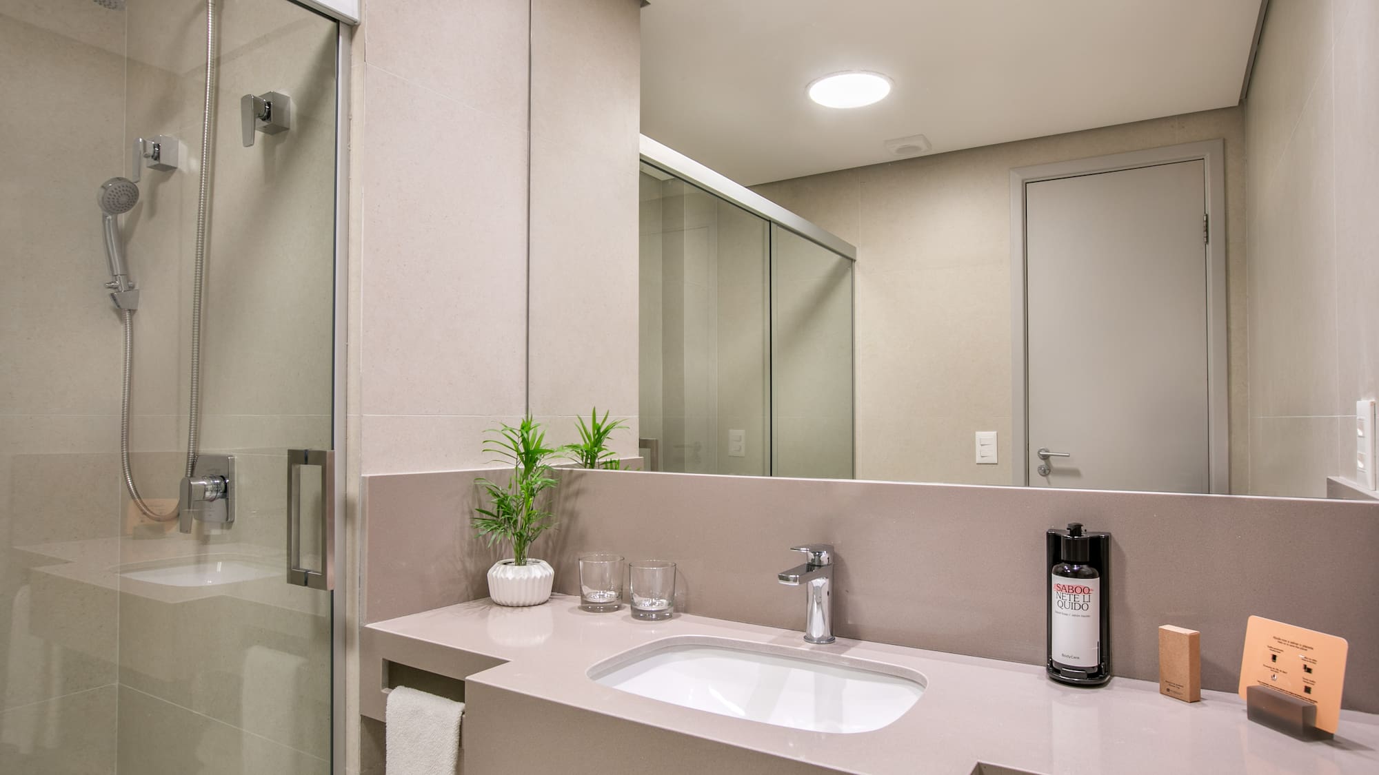 a bathroom with a sink and shower