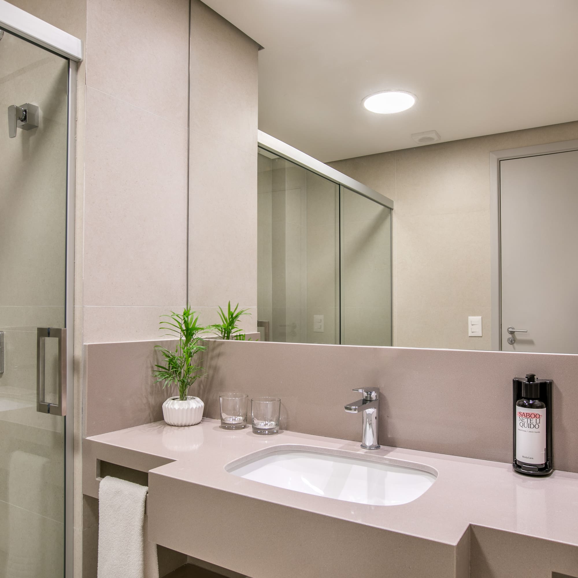 a bathroom with a sink and shower