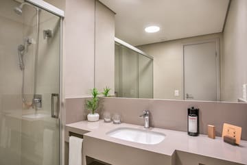 a bathroom with a sink and shower