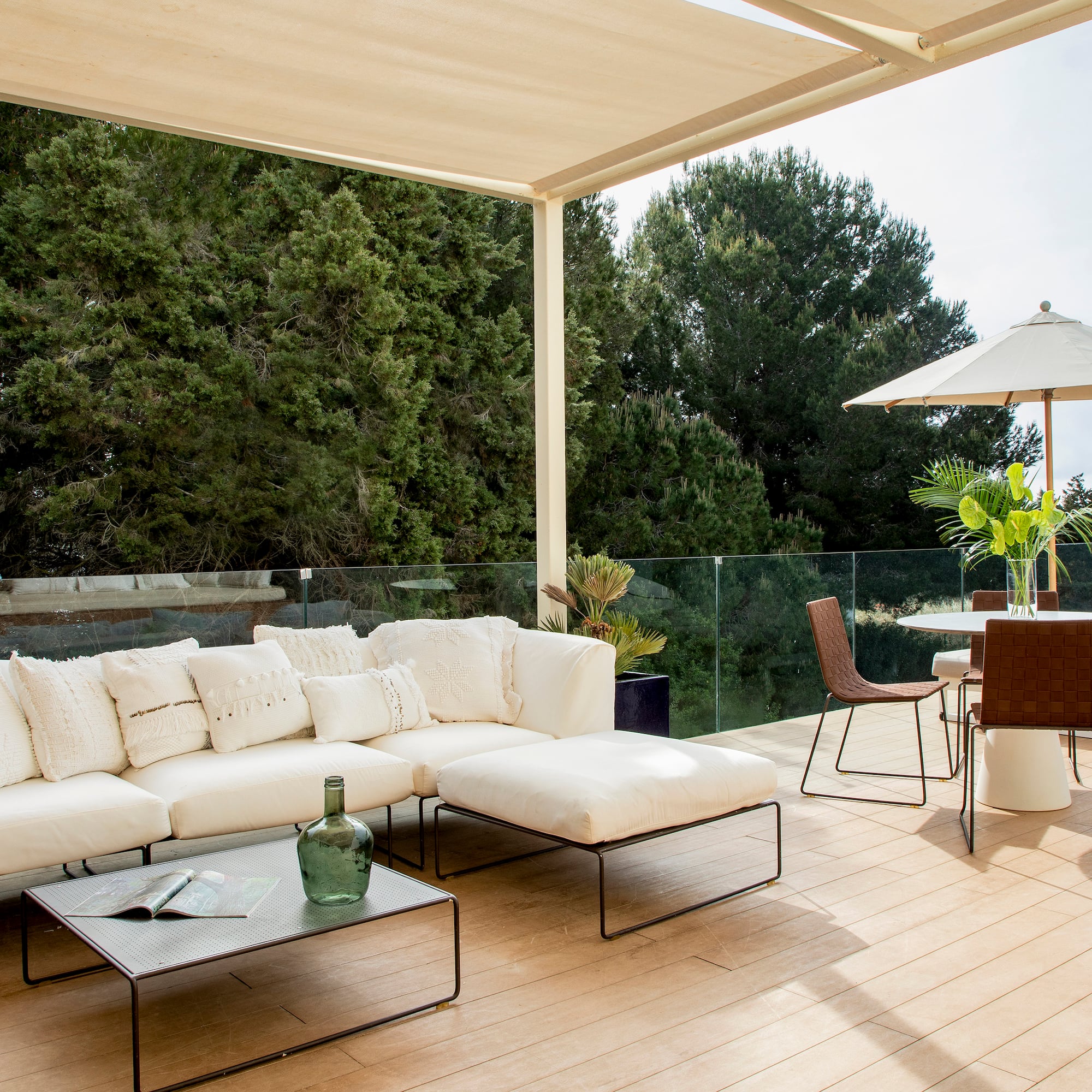 a patio with a white couch and a table