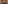 Tropical restaurant with thatched roof, warm lighting, and elegant dining tables.