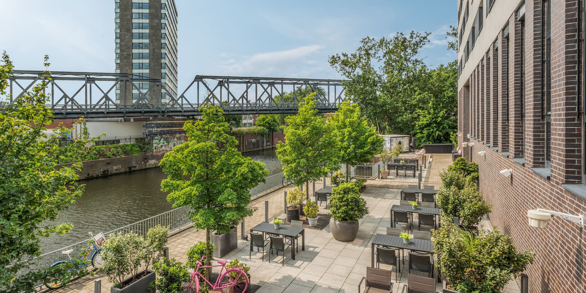 a river with tables and chairs