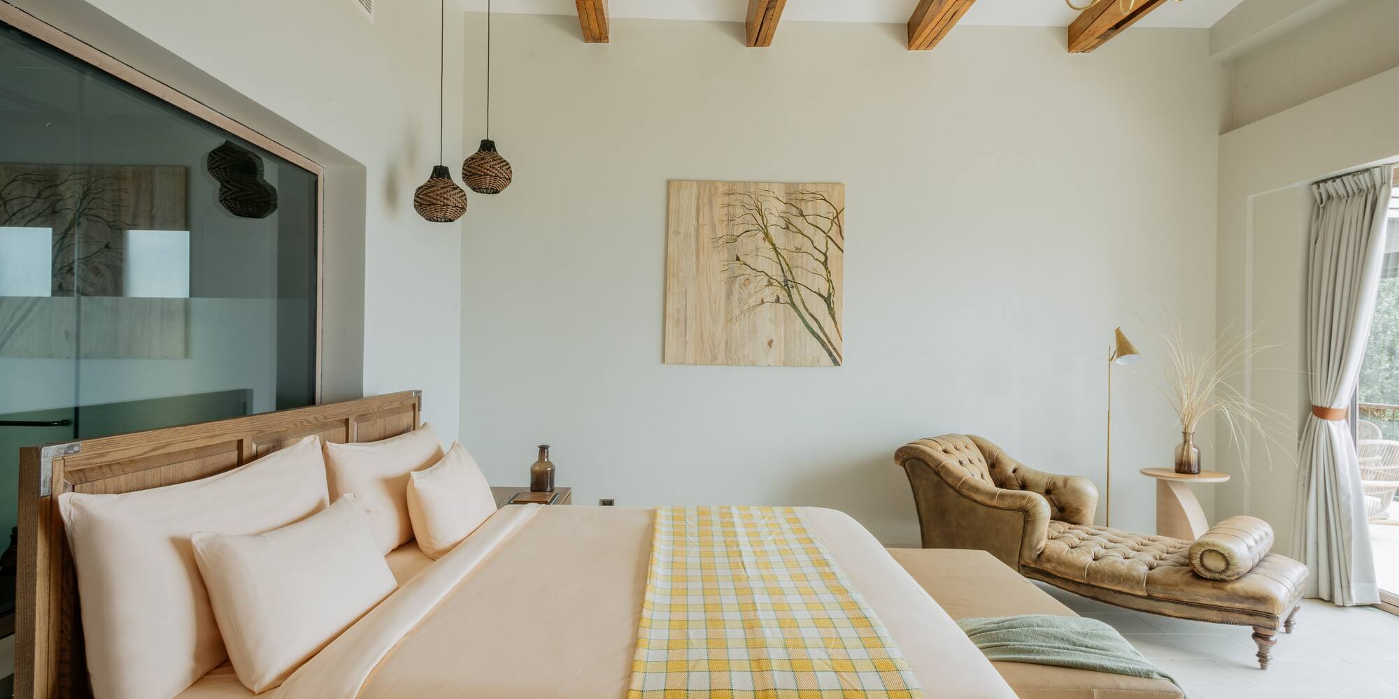 a bedroom with a bed and a couch