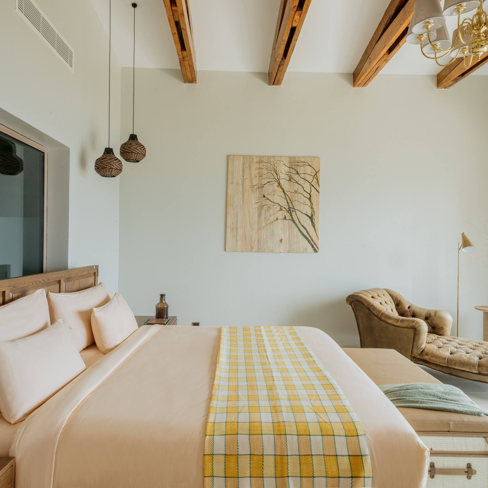 a bedroom with a bed and a couch