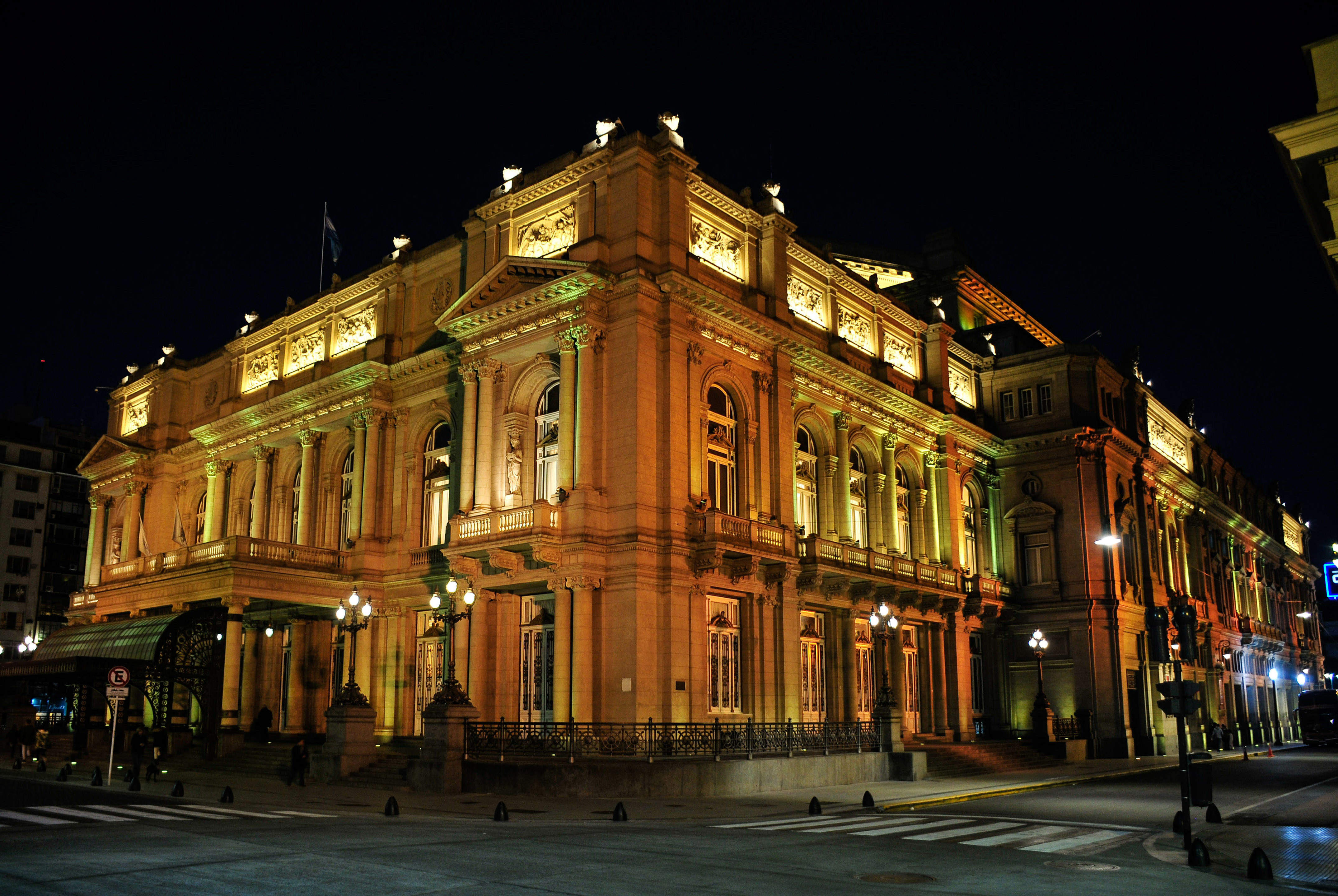 Teatro Colón, Buenos Aires, illuminated at night, neoclassical architecture.