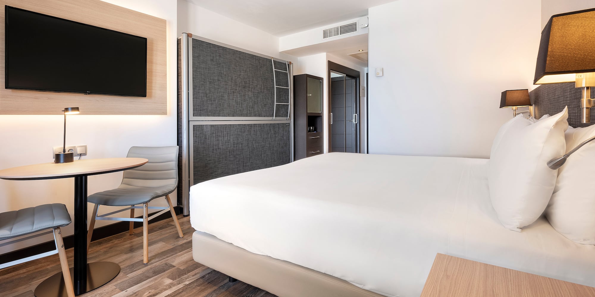 a room with a bed and a table