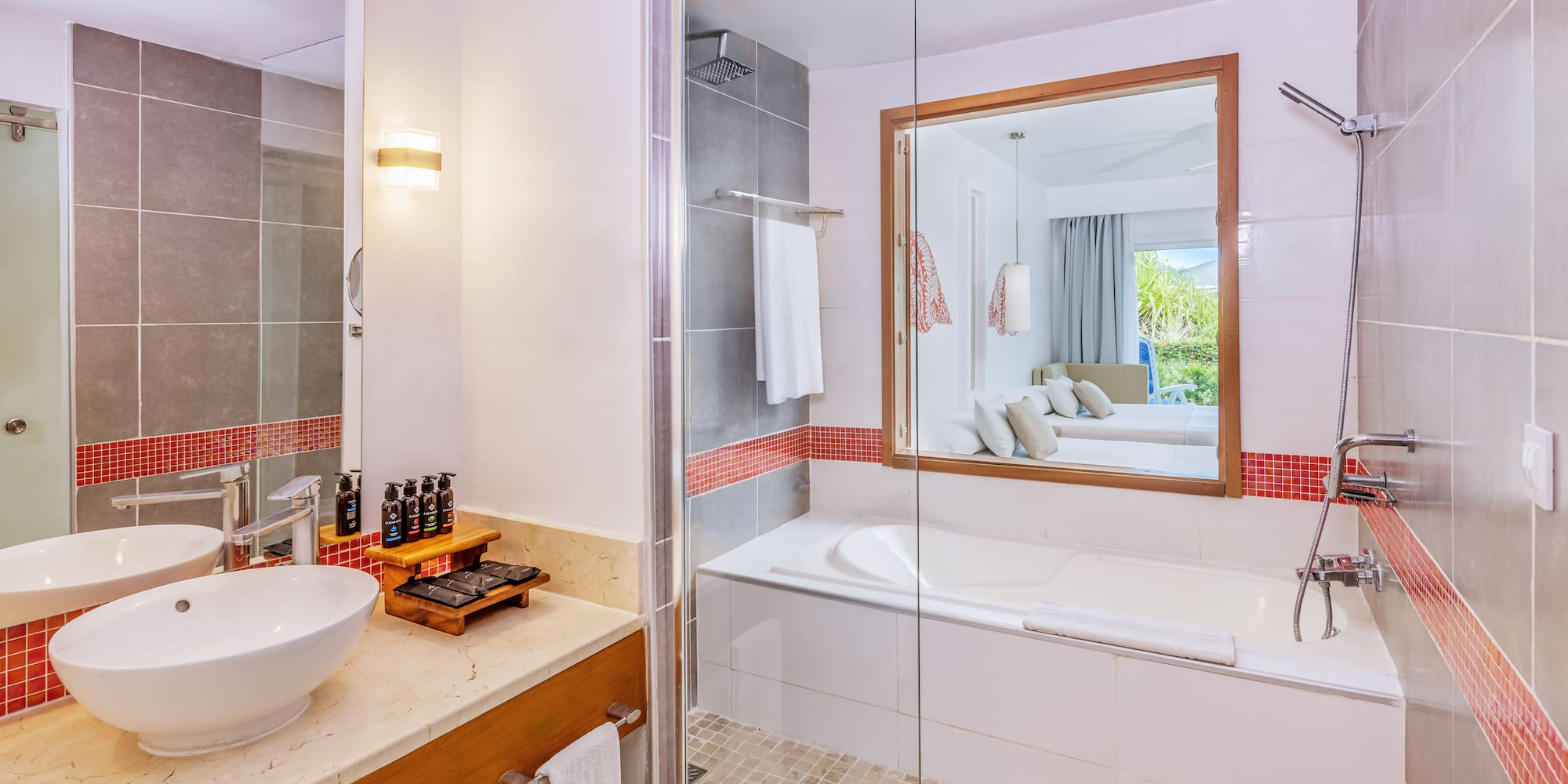 a bathroom with a glass shower door and a sink