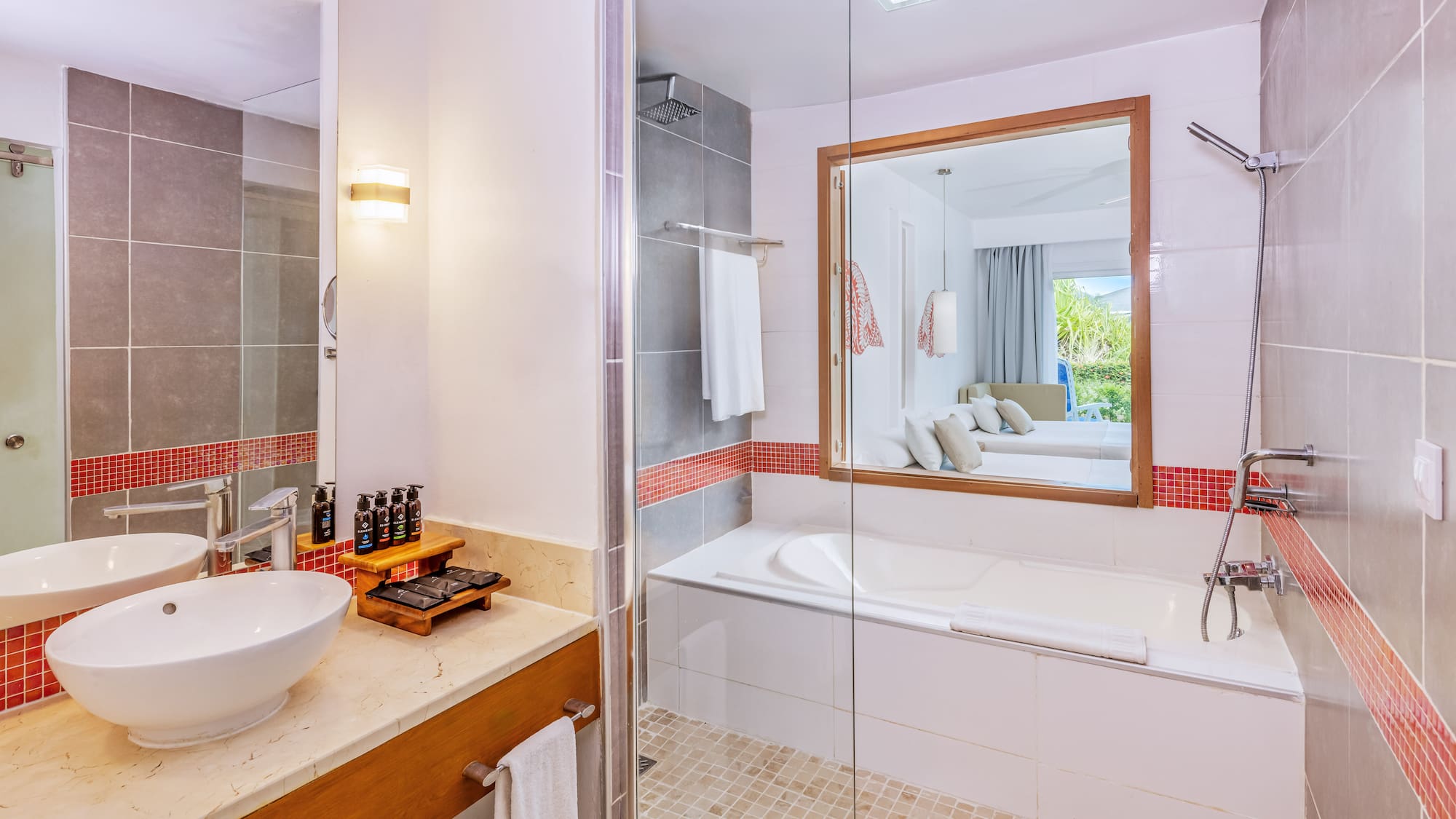 a bathroom with a glass shower door and a sink