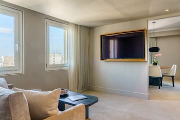 a living room with a television on the wall