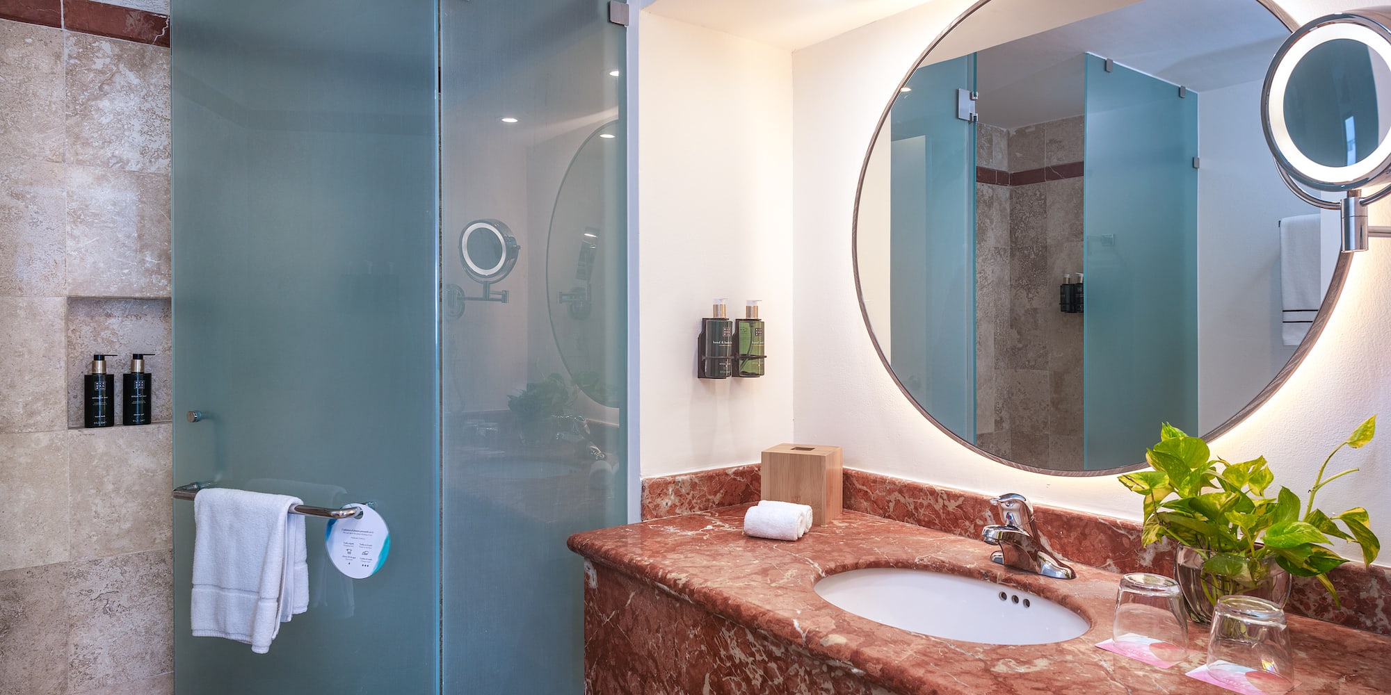 a bathroom with a mirror and a sink