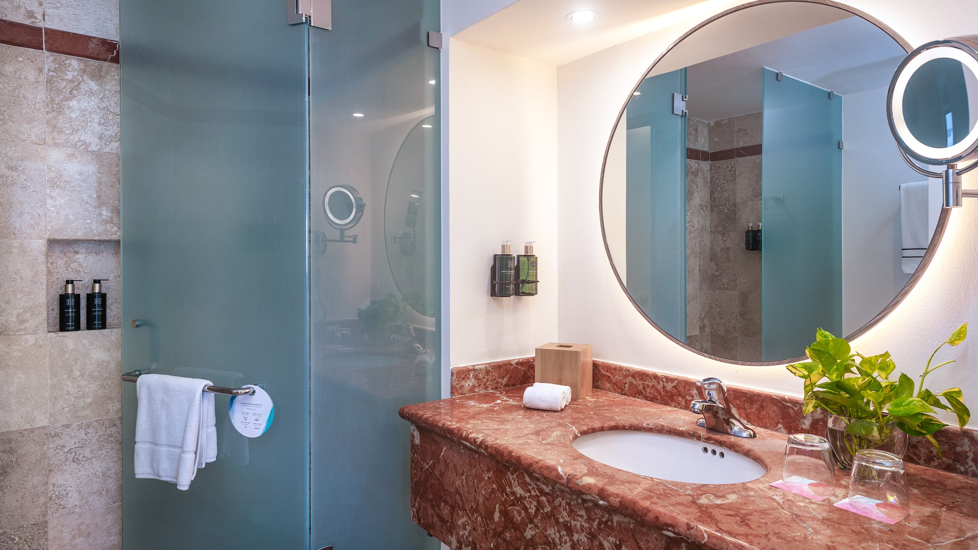 a bathroom with a mirror and a sink