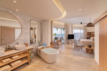 a bathroom with a tub and a mirror