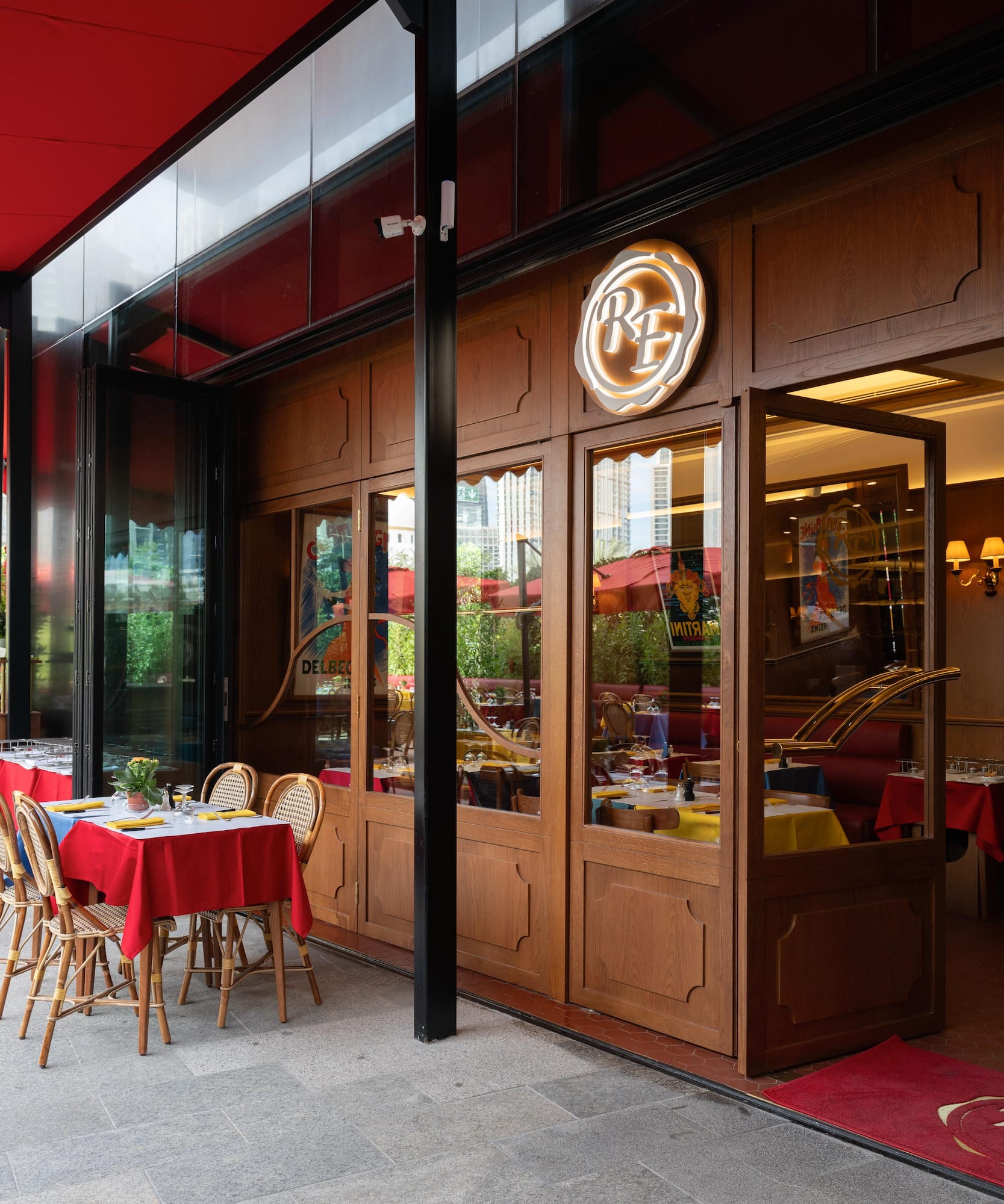 a restaurant with tables and chairs outside