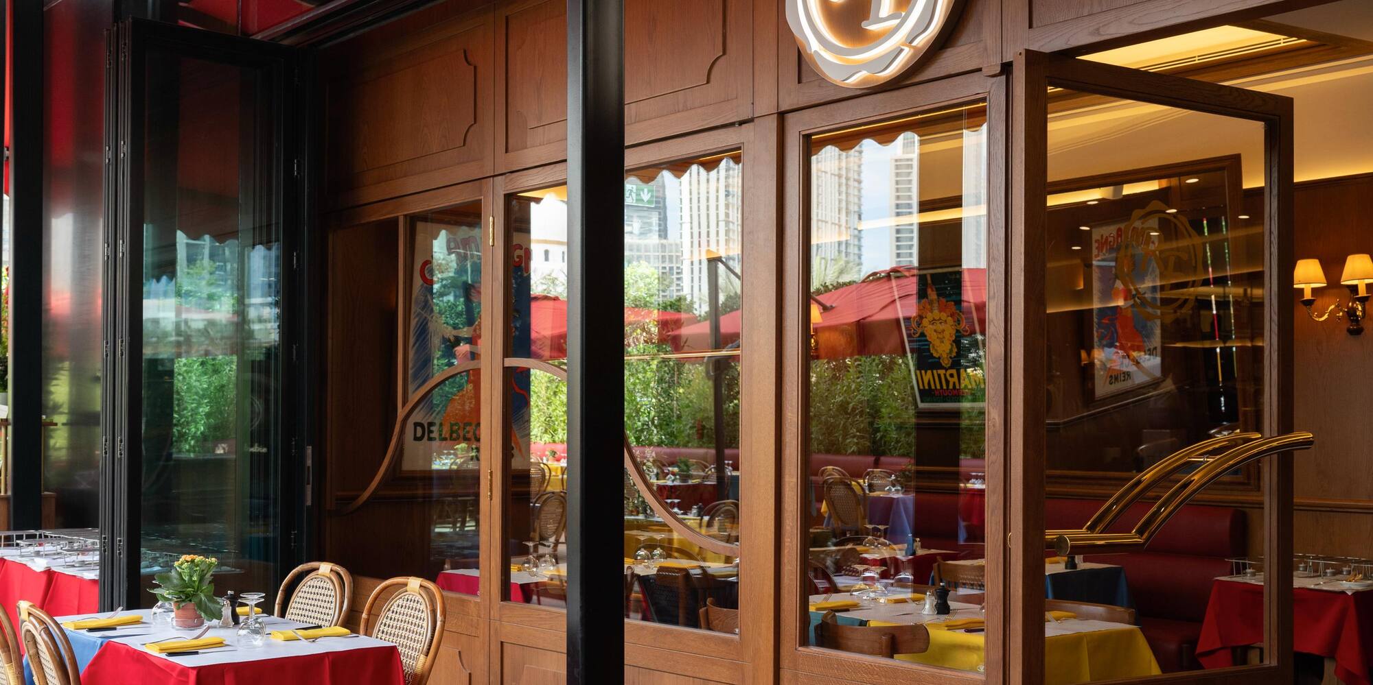 a restaurant with tables and chairs outside