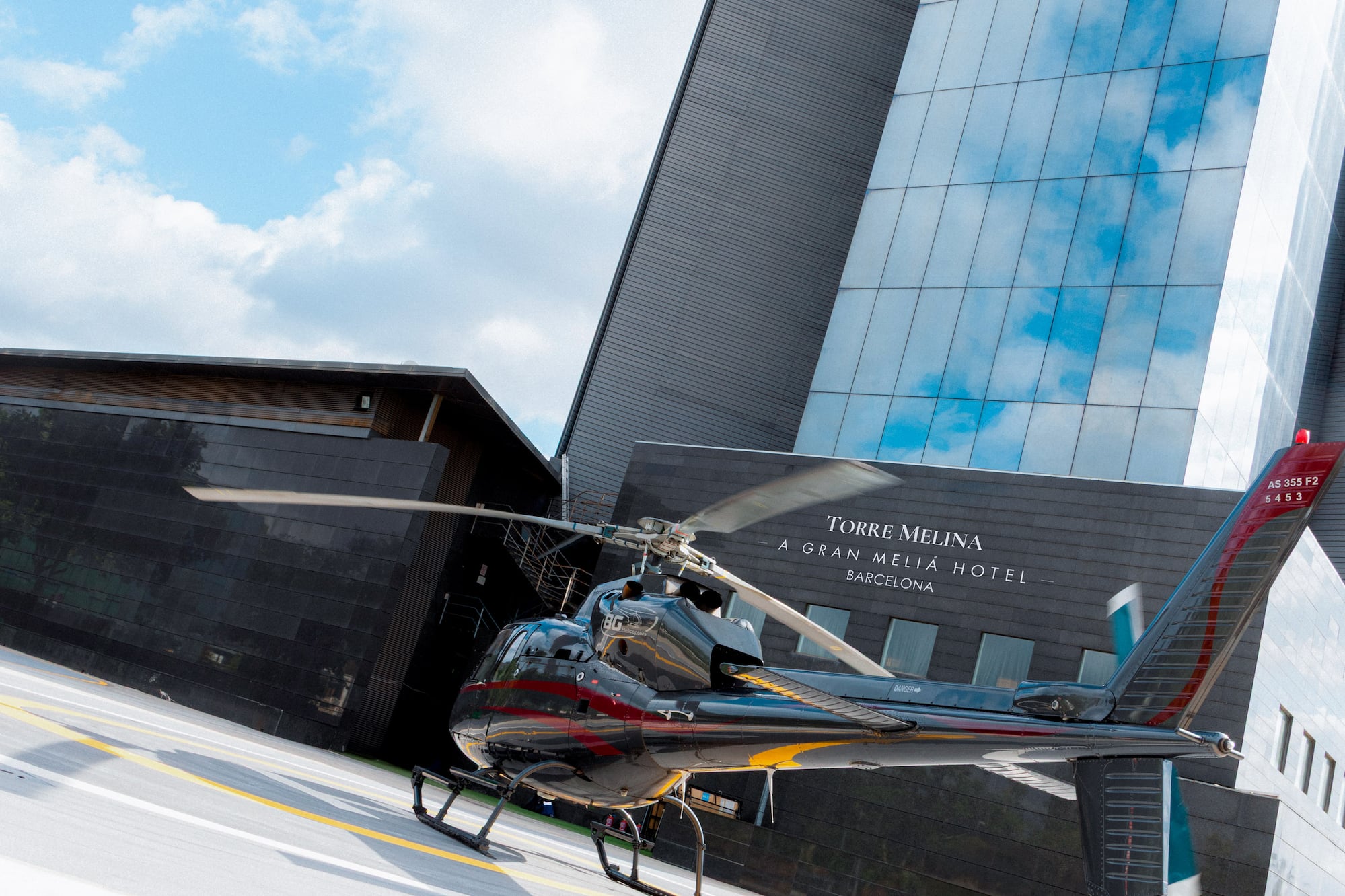 a helicopter parked in front of a building