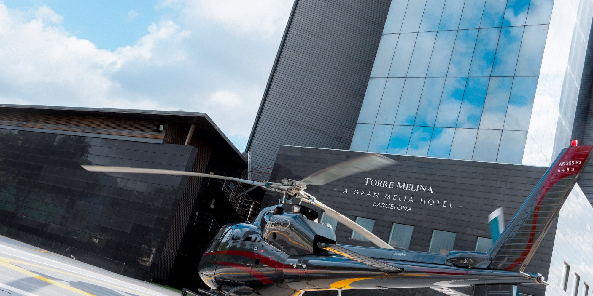 a helicopter parked in front of a building