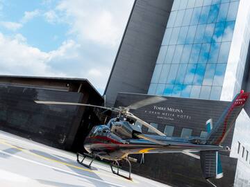 a helicopter parked in front of a building