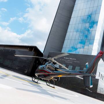 a helicopter parked in front of a building