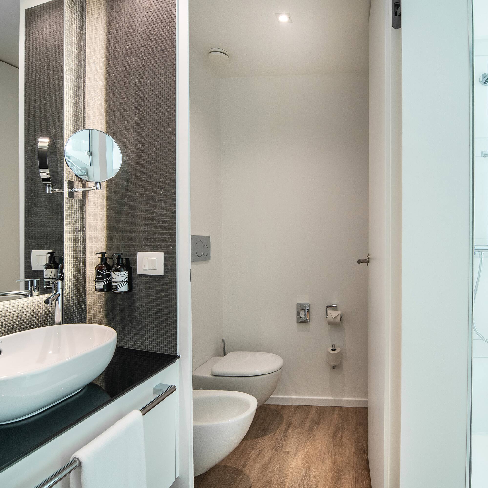 a bathroom with a toilet and sink