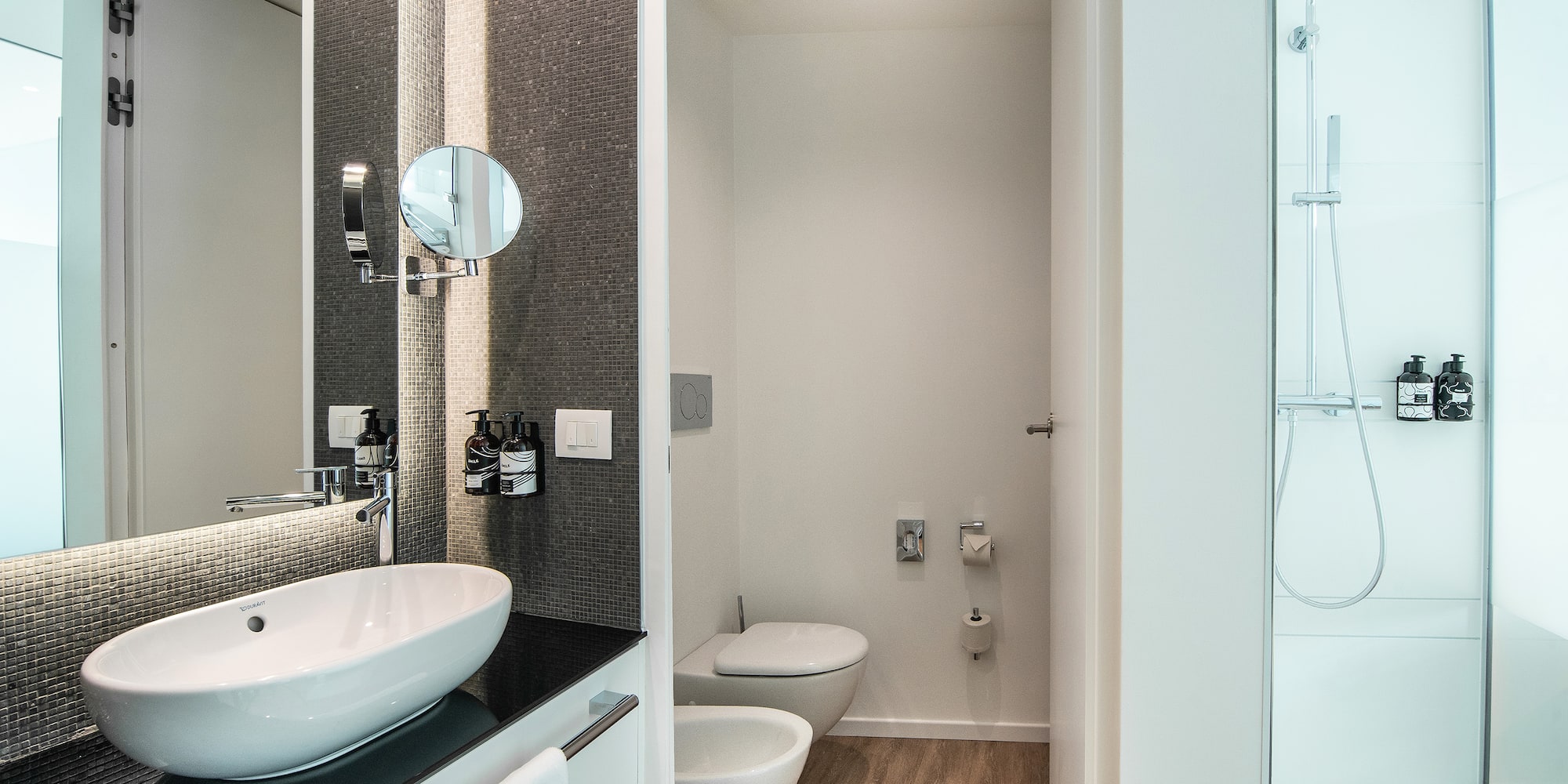 a bathroom with a toilet and sink