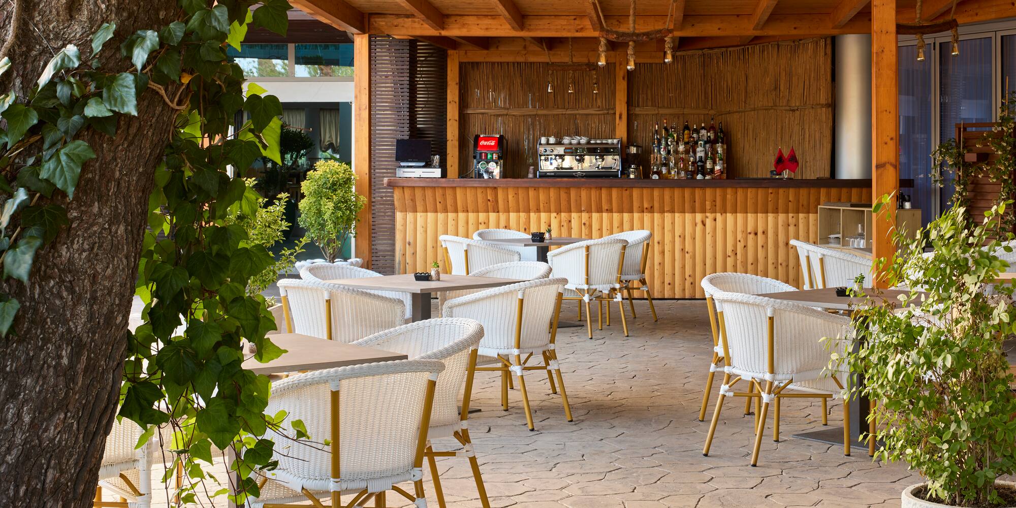 a patio with tables and chairs