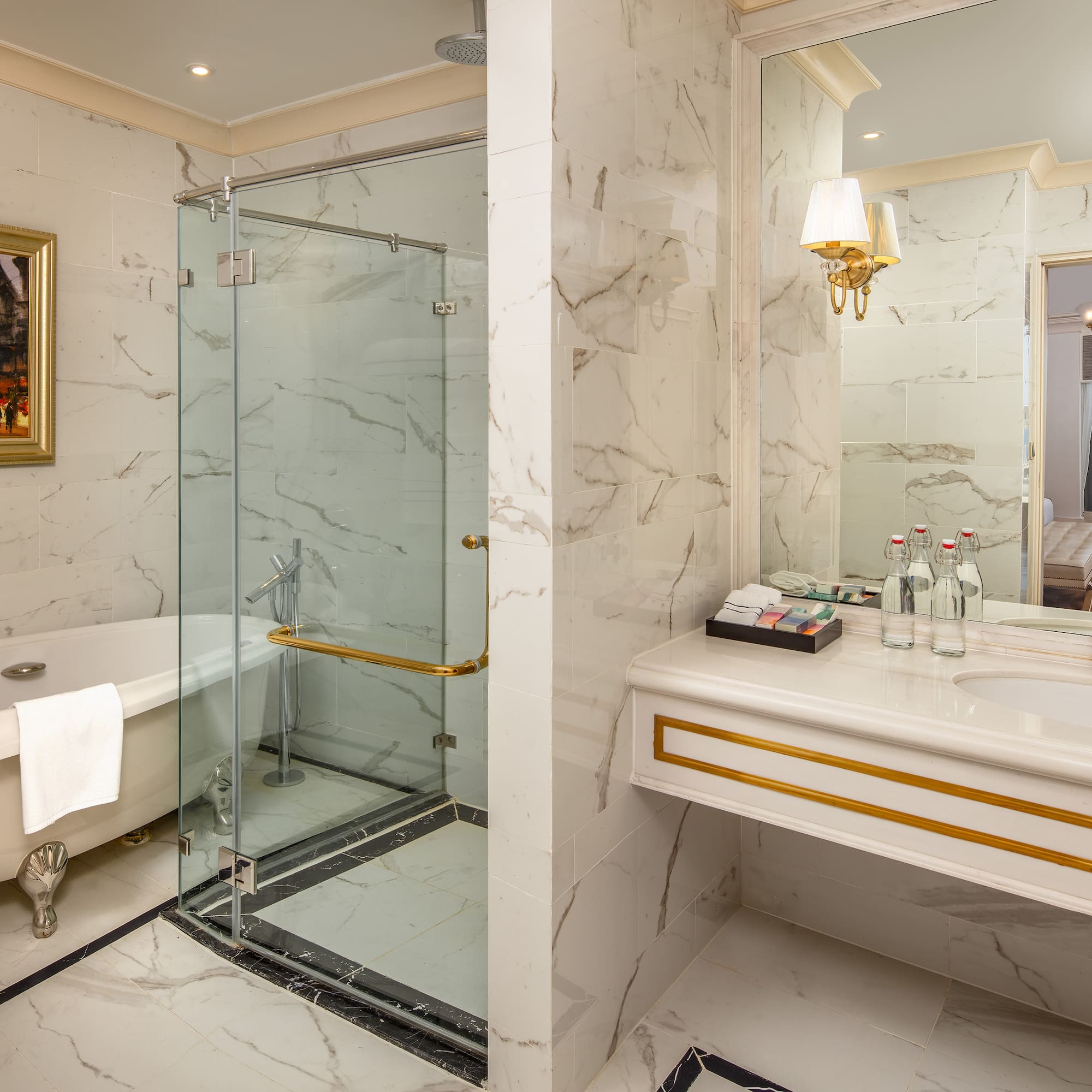 a bathroom with a glass shower and a bathtub