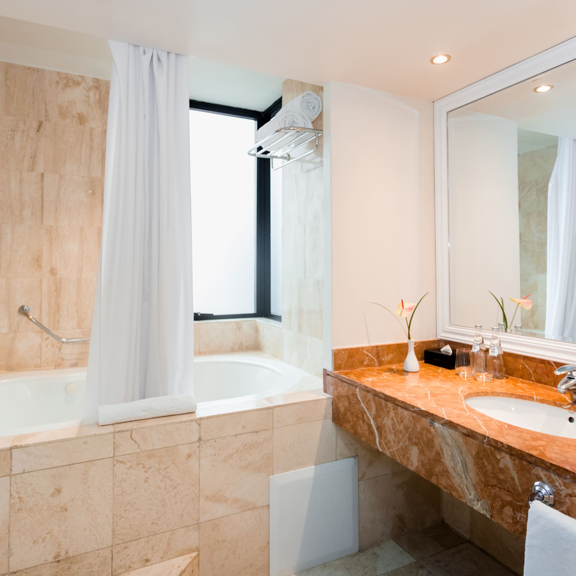 a bathroom with a tub and sink