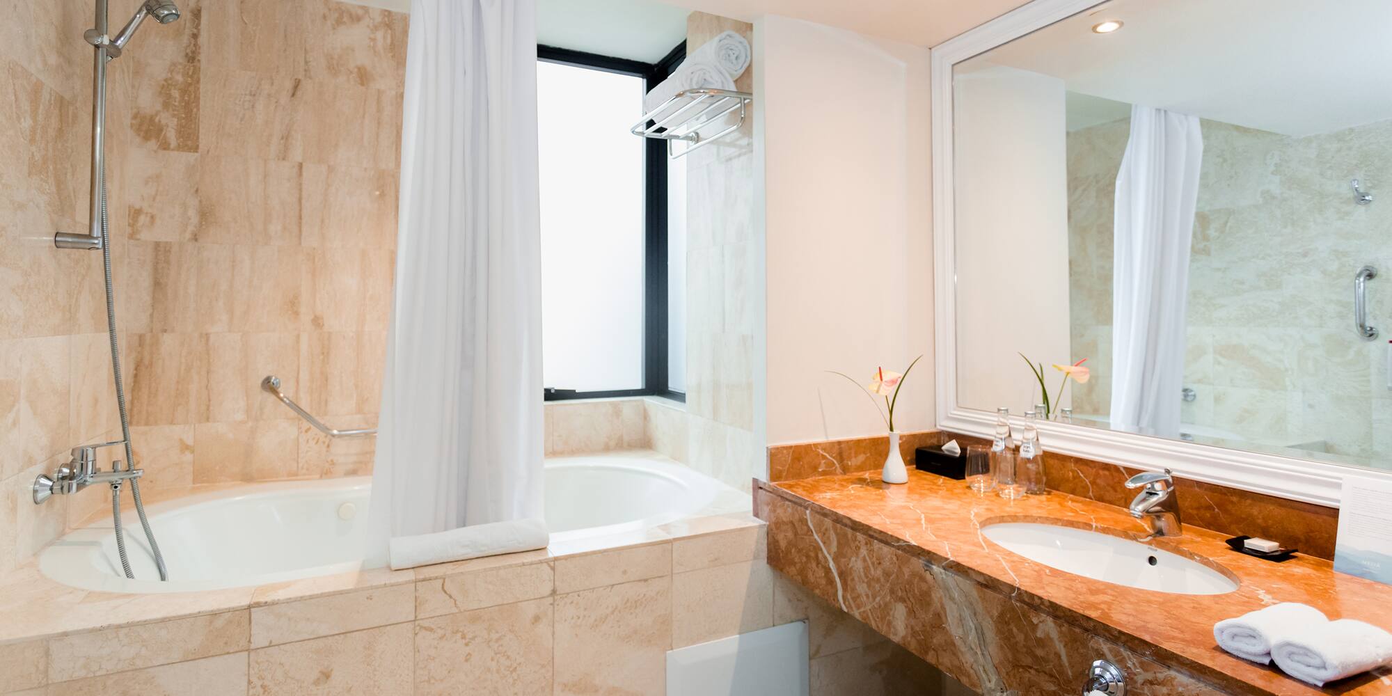 a bathroom with a tub and sink