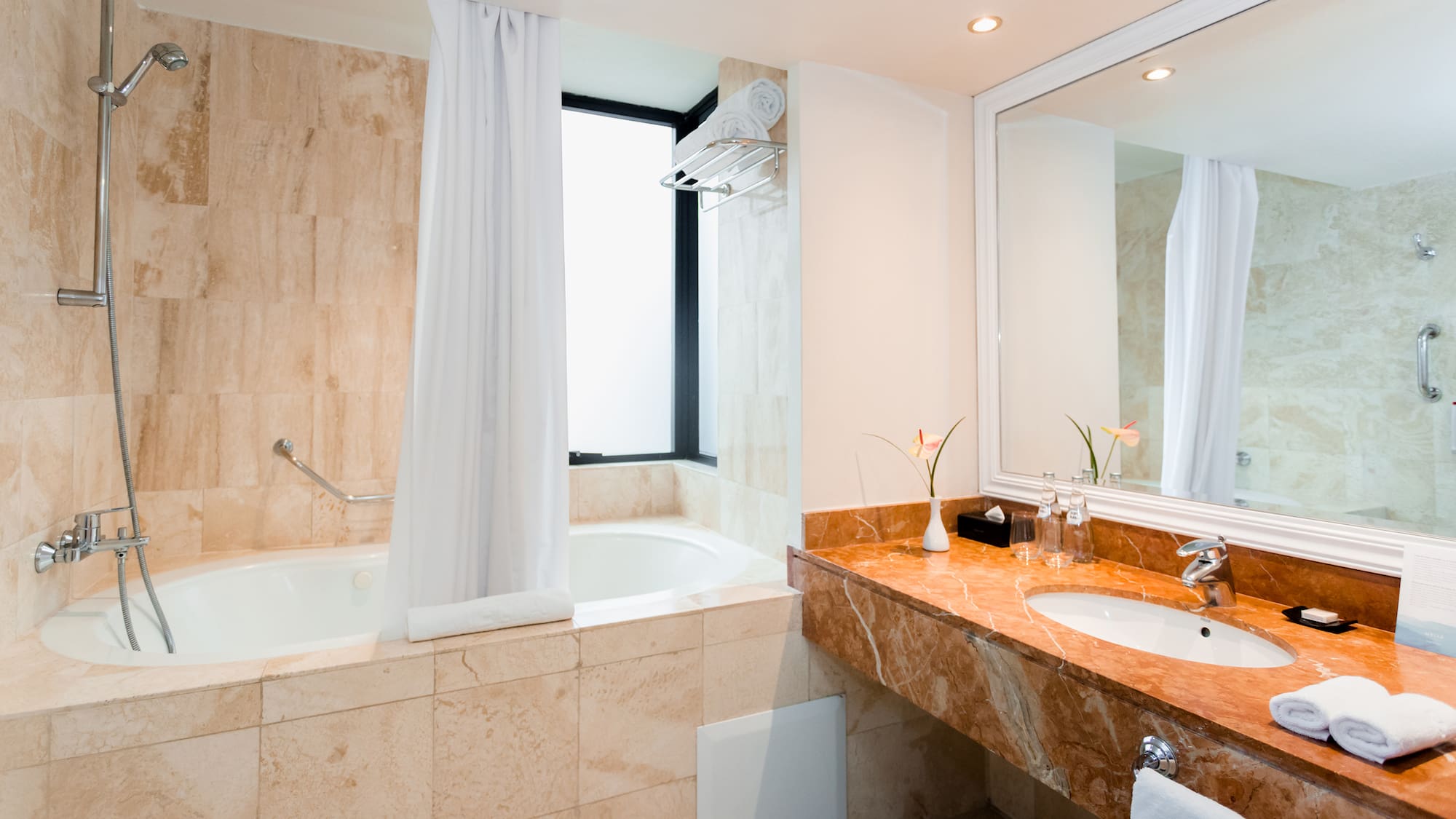 a bathroom with a tub and sink