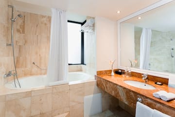 a bathroom with a tub and sink