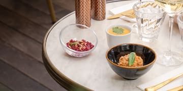 a table with a variety of glasses and food on it