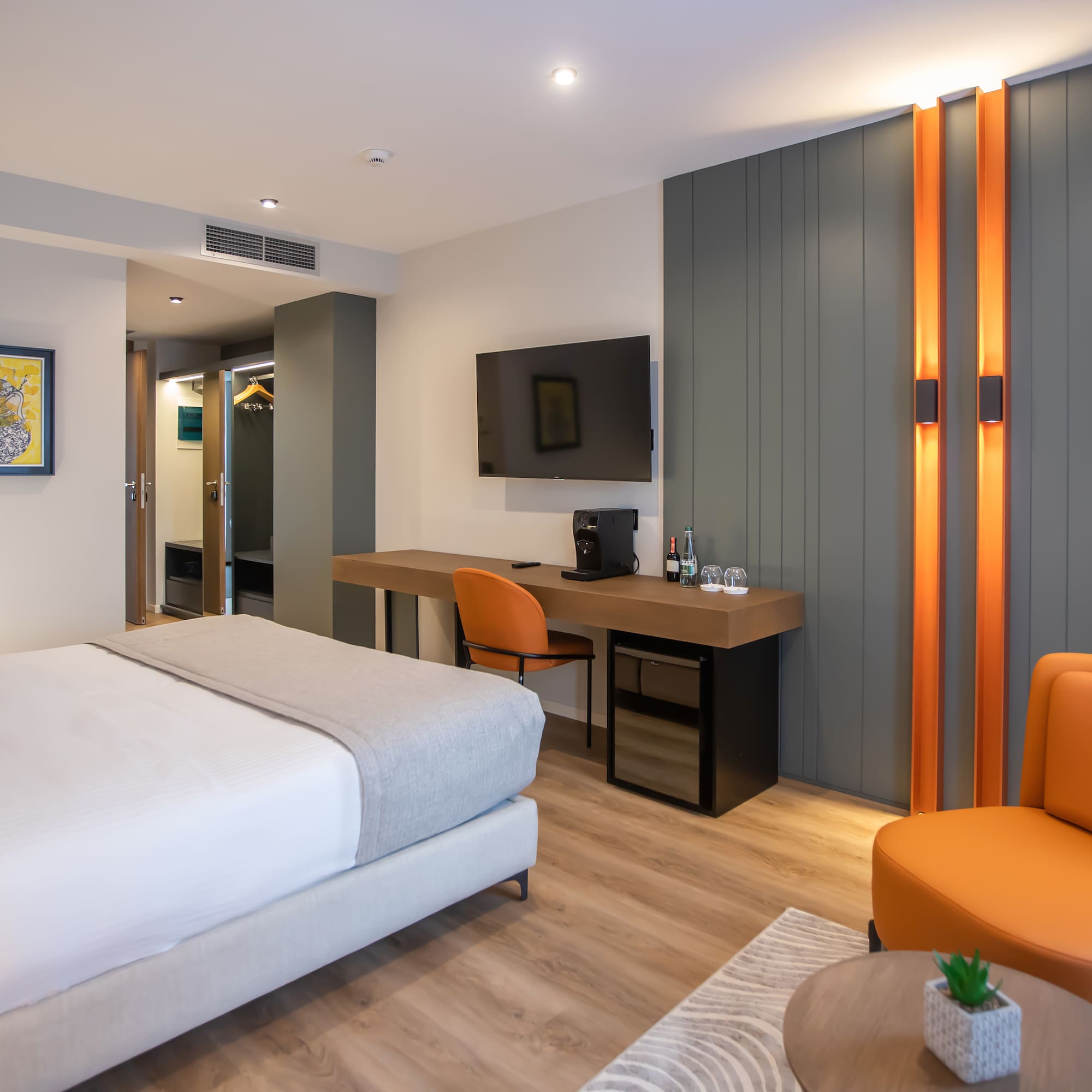 a room with a bed and a desk and chair