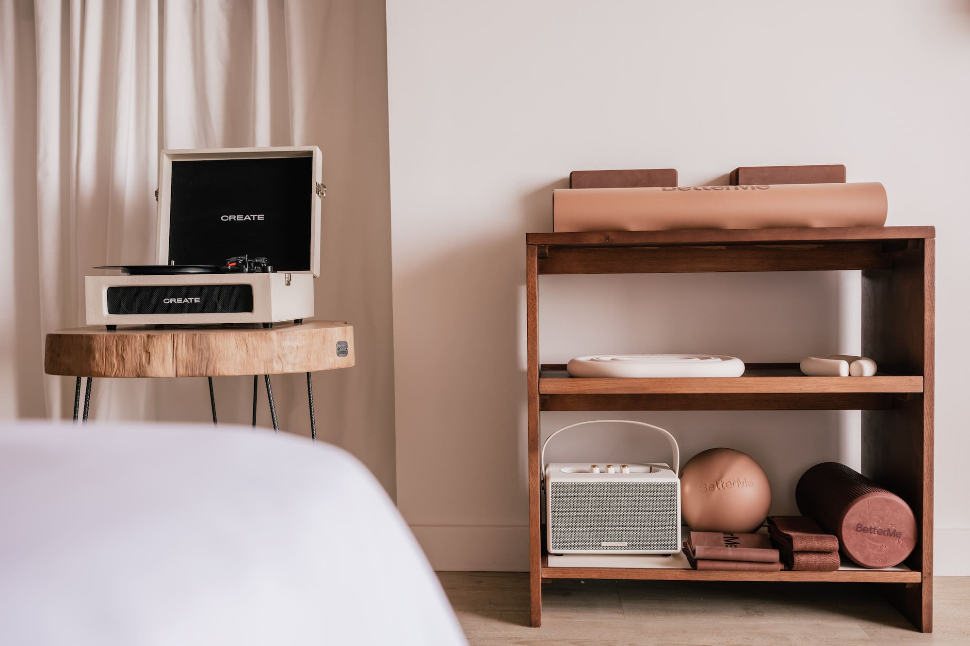 Record player, BetterMe yoga mat, foam roller, and home fitness essentials.