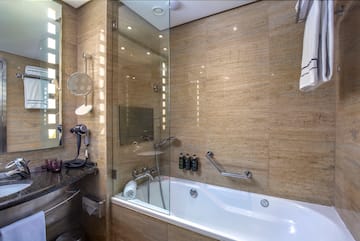 a bathroom with a bathtub and shower