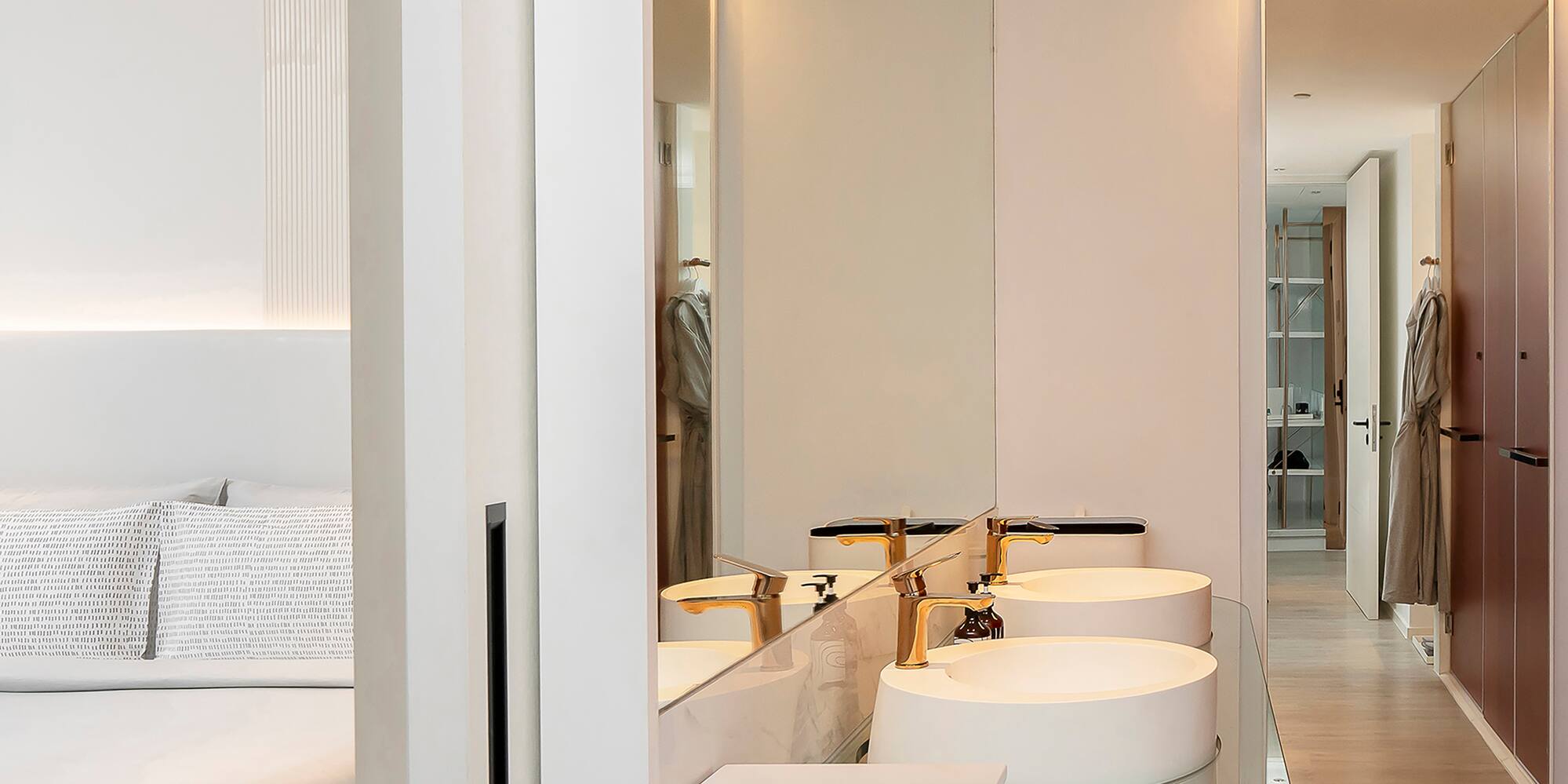 a bathroom with a double sink and a mirror