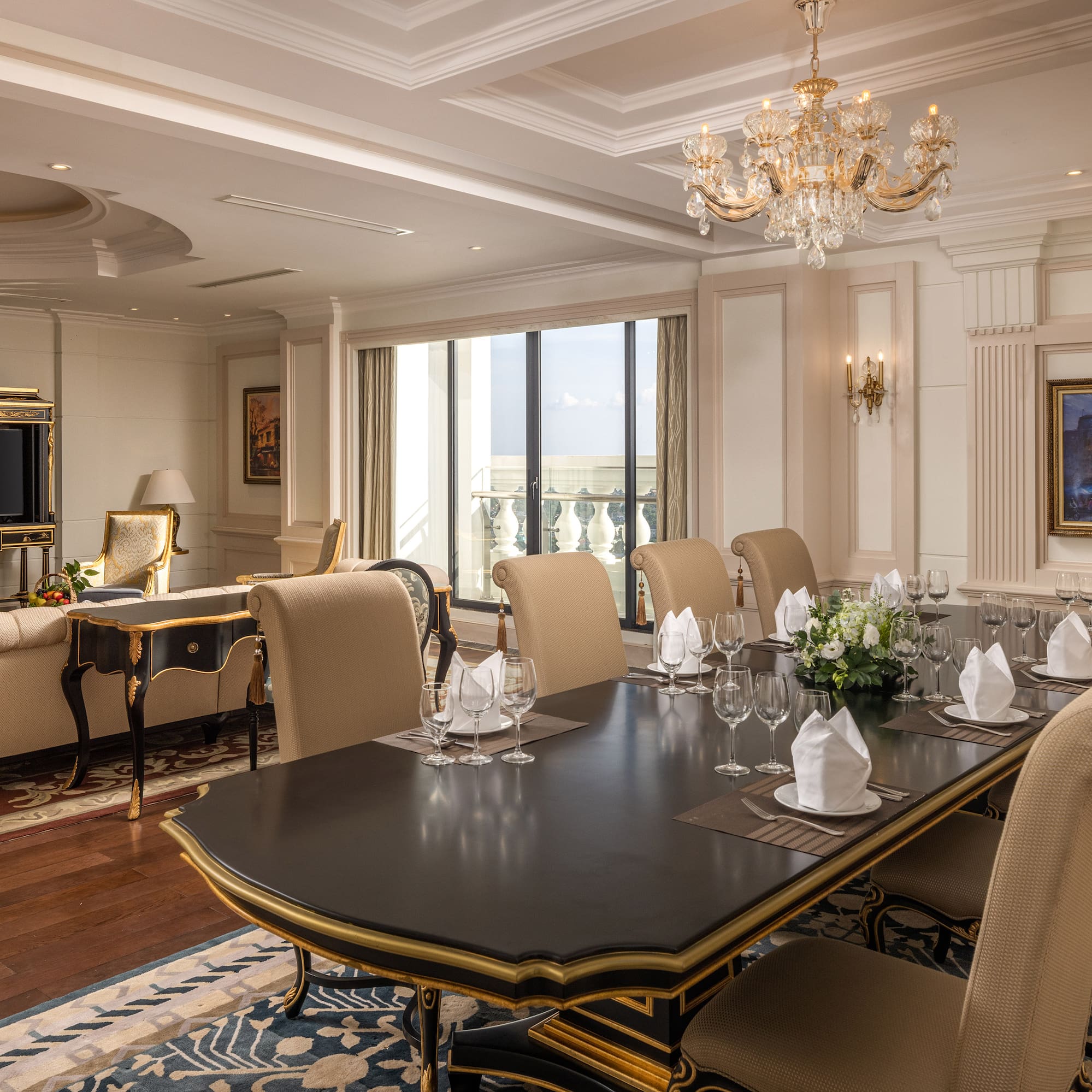 a room with a large table and chairs