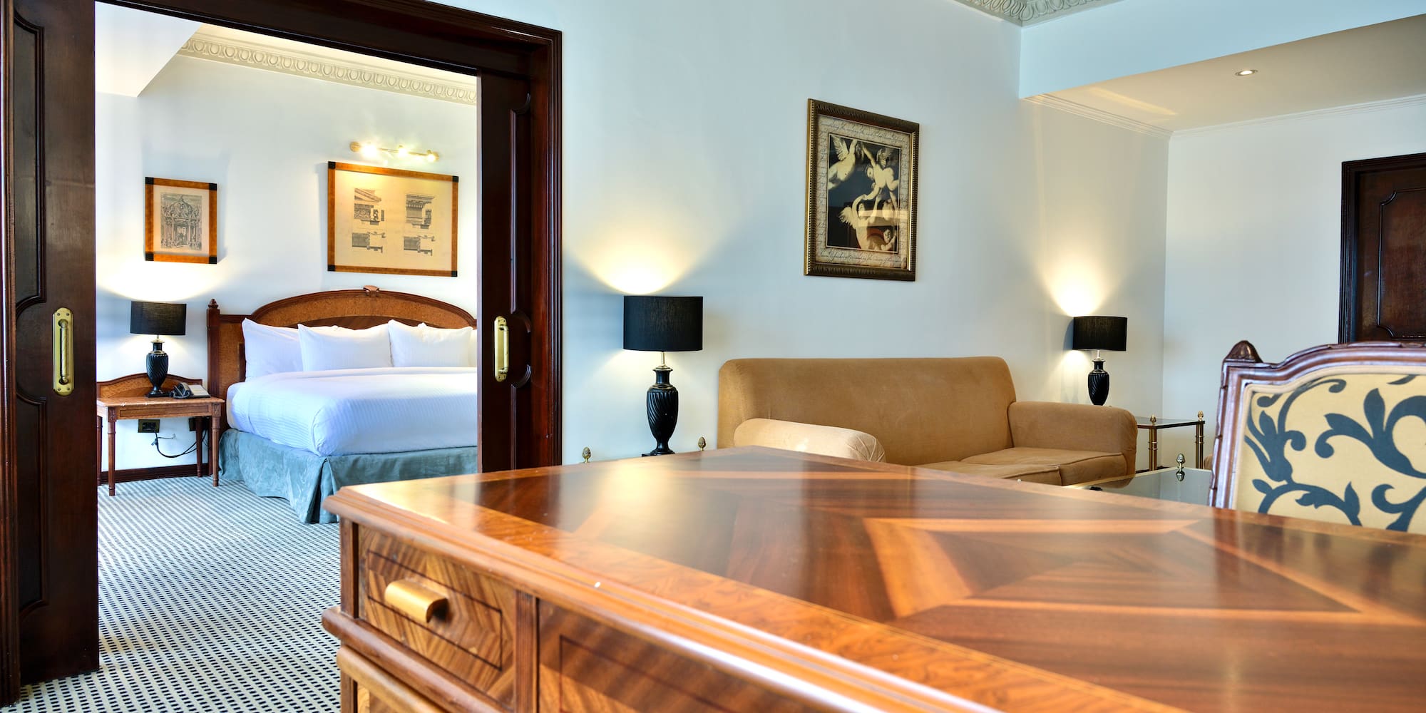 a room with a bed and a desk