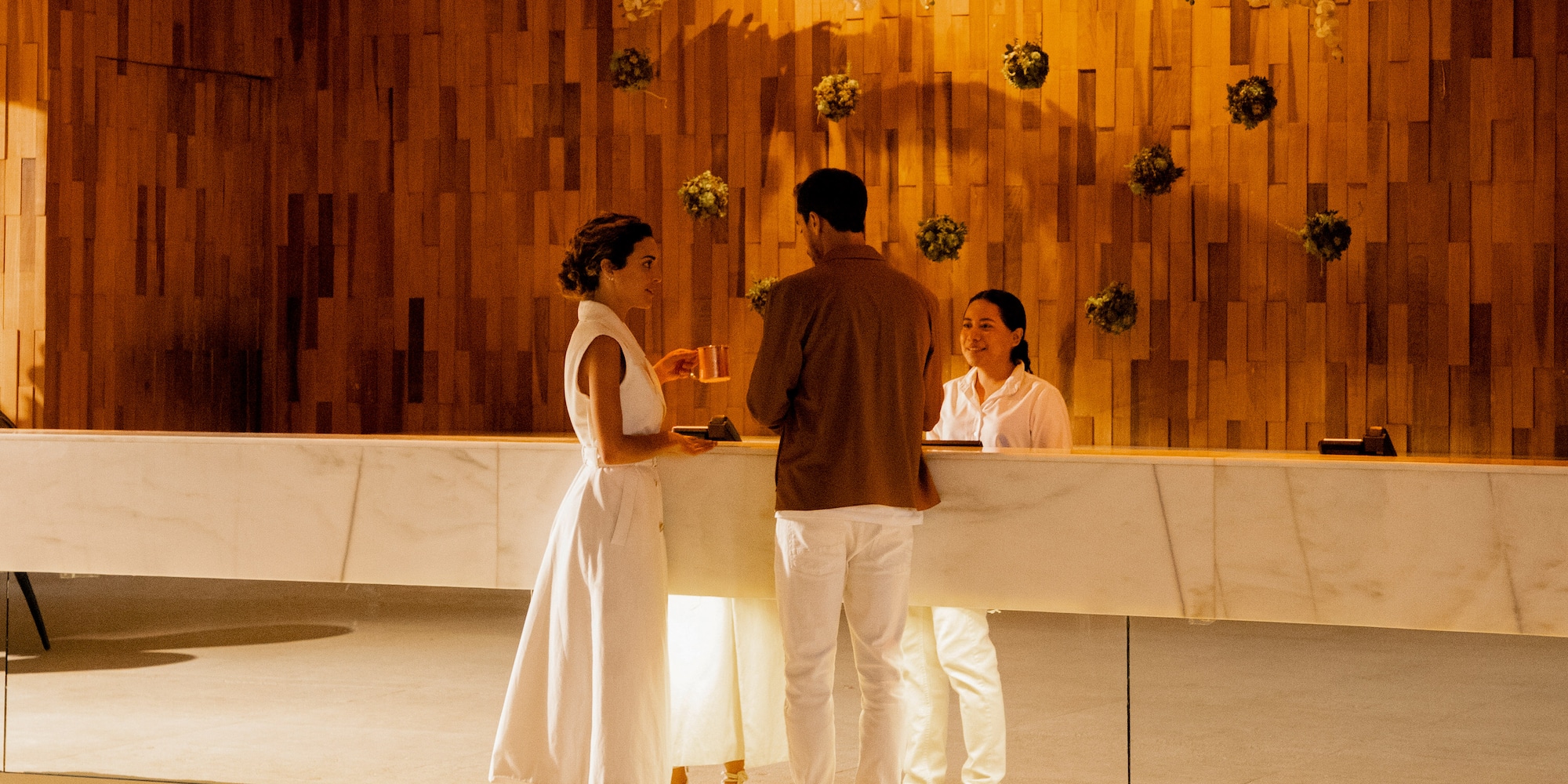a group of people standing at a counter