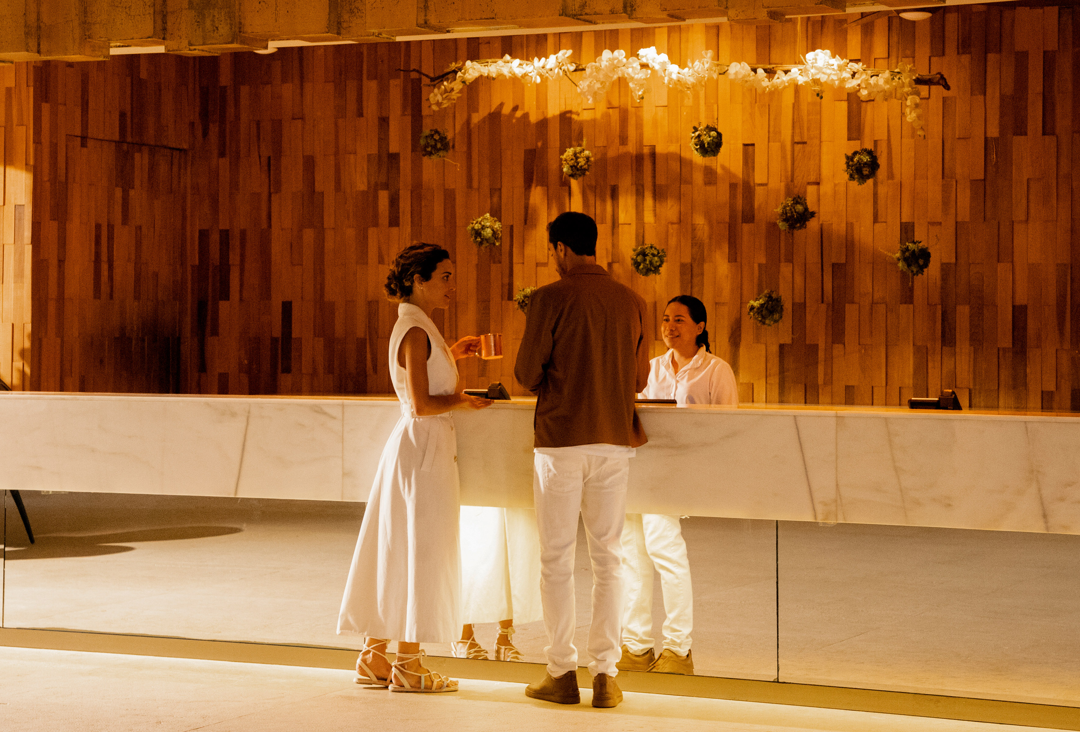 a group of people standing at a counter