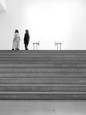 two women walking up a staircase
