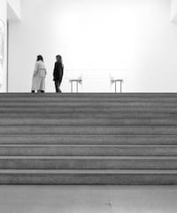 two women walking up a staircase