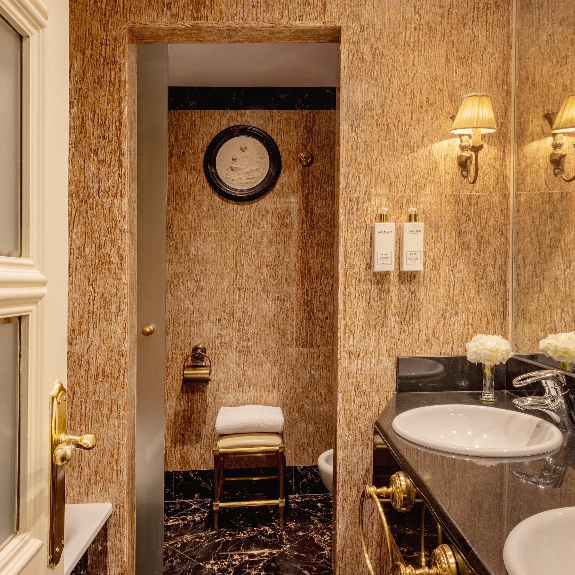 a bathroom with marble walls and sink