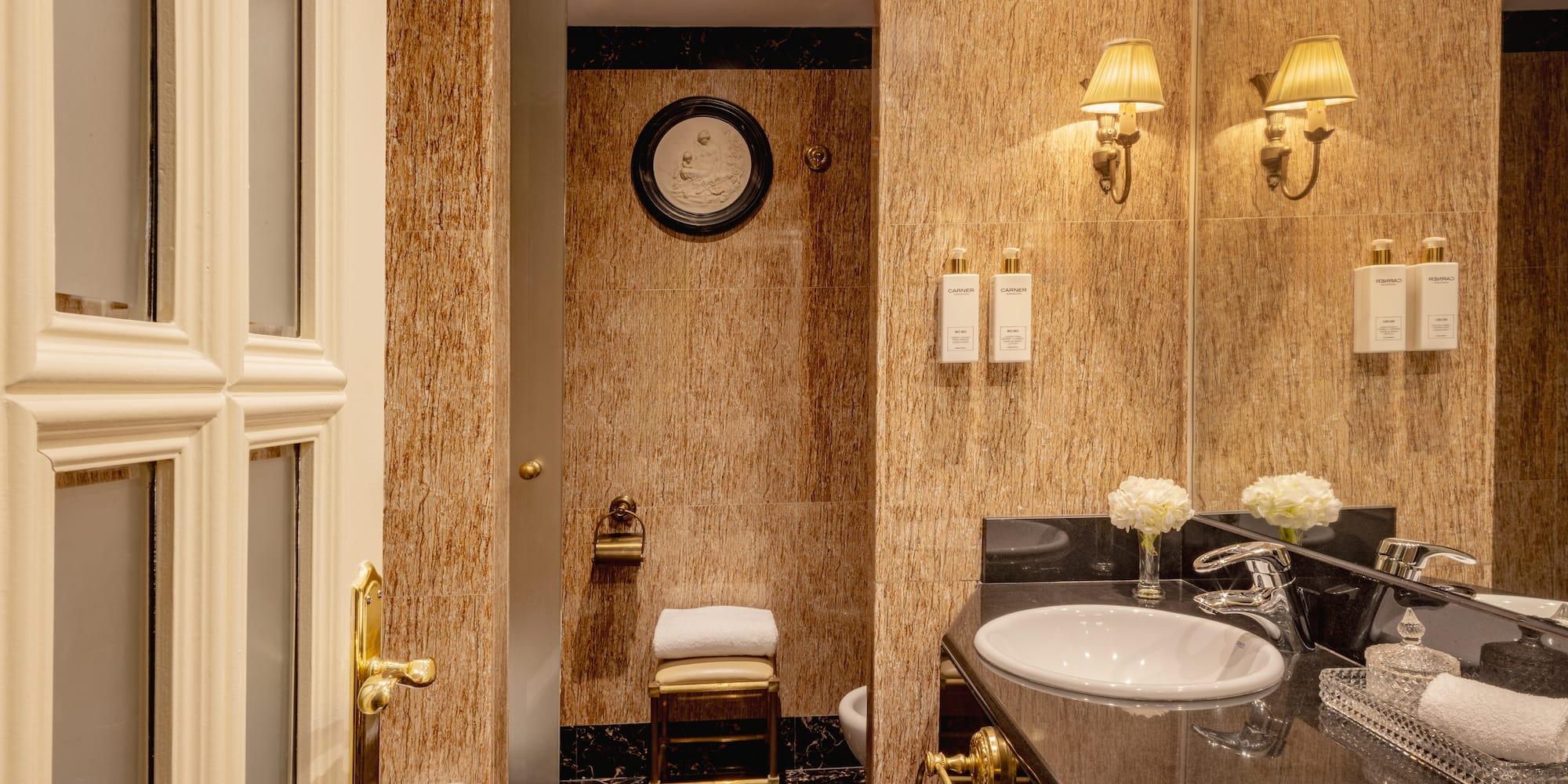 a bathroom with marble walls and sink