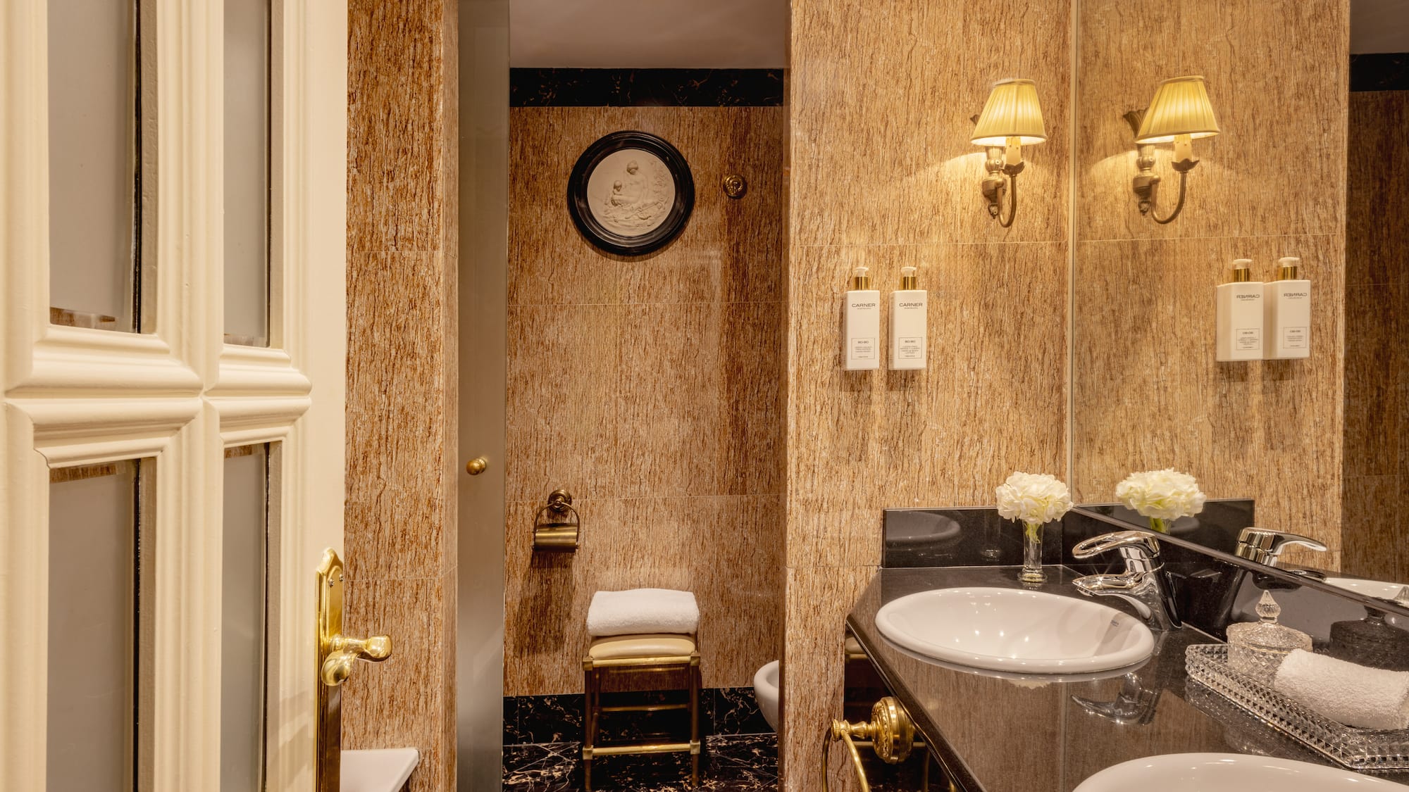 a bathroom with marble walls and sink