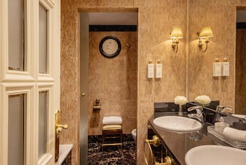 a bathroom with marble walls and sink