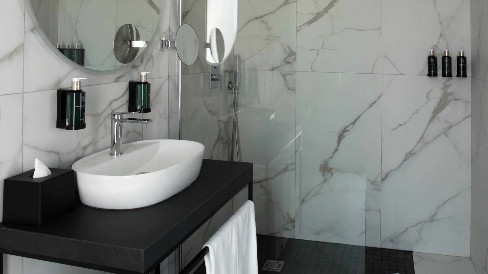 a bathroom with a sink and shower