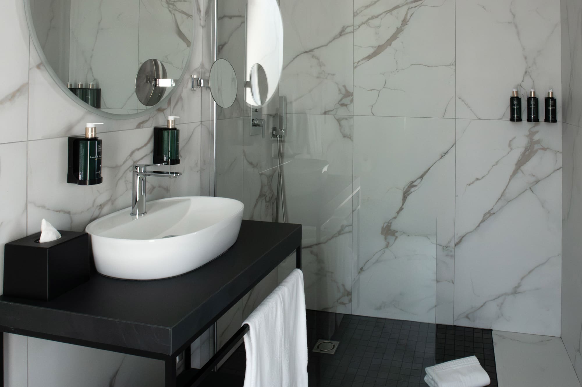 a bathroom with a sink and shower