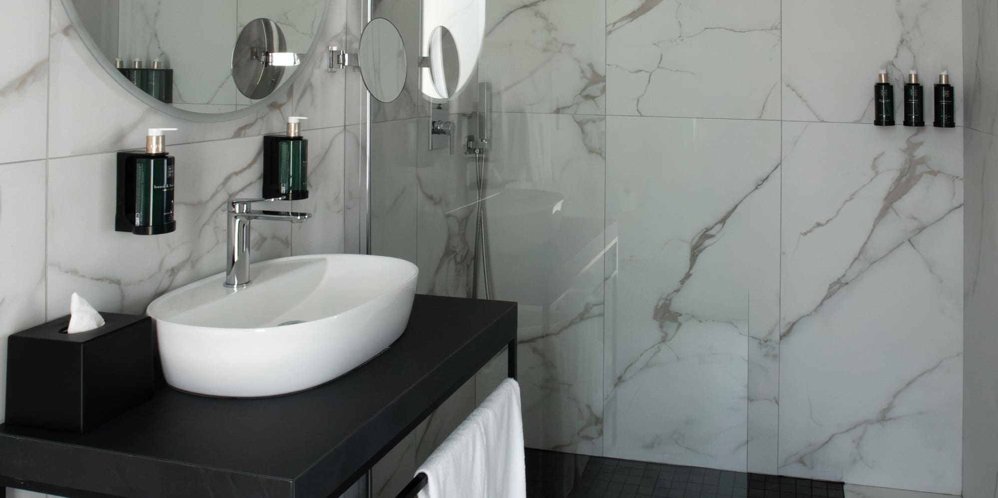 a bathroom with a sink and shower